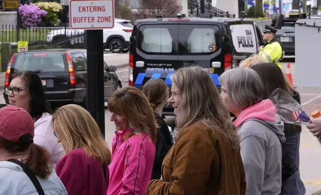 Supporters of Karen Read gather outside a buffer zone and watch Read's trial at Norfolk Superior Court, Tuesday, April 22, 2025, in Dedham, Mass. (AP Photo/Charles Krupa)