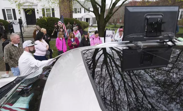 Supporters of Karen Read gather outside a buffer zone and watch Read's trial at Norfolk Superior Court, Tuesday, April 22, 2025, in Dedham, Mass. (AP Photo/Charles Krupa)