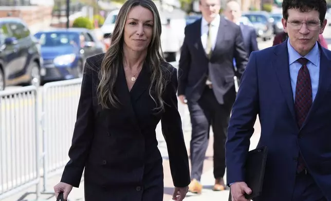 Karen Read, left, returns to court following the lunch break with her defense attorney Robert Alessi at her trial at Norfolk Superior Court, Tuesday, April 22, 2025, in Dedham, Mass. (AP Photo/Charles Krupa)