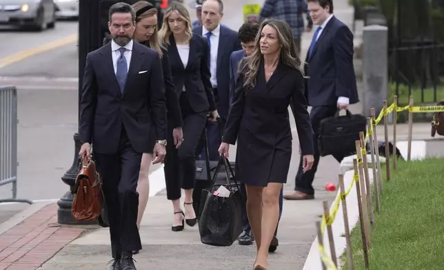 Karen Read arrives with her defense team for her trial at Norfolk Superior Court, Tuesday, April 22, 2025, in Dedham, Mass. (AP Photo/Charles Krupa)