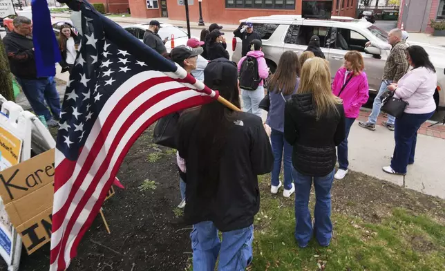 Supporters of Karen Read gather outside a buffer zone and watch Read's trial at Norfolk Superior Court, Tuesday, April 22, 2025, in Dedham, Mass. (AP Photo/Charles Krupa)