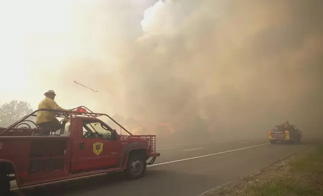 Smoke fills the sky as firefighters battle a wildfire in Lacey Townships, N.J. on Tuesday, April 22, 2025. (New Jersey Department of Environmental Protection via AP)