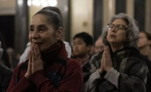 Greek Catholic believers and foreigners who live in Greece attend the mass of last supper at the Catholic Cathedral Basilica of St Dionysius the Areopagite in Athens, Greece, Holy Thursday, April 17, 2025. (AP Photo/Thanassis Stavrakis)