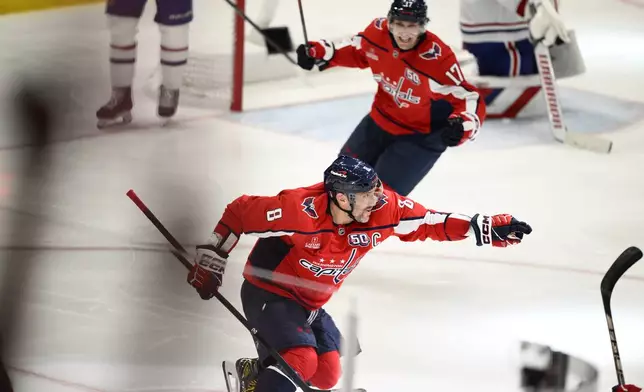 Washington Capitals left wing Alex Ovechkin (8) celebrates after his winning goal in overtime of Game 1 of a first-round NHL hockey playoff series against the Montreal Canadiens, Monday, April 21, 2025, in Washington. (AP Photo/Nick Wass)