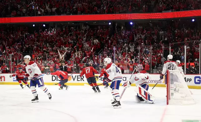 Washington Capitals left wing Alex Ovechkin (8) celebrates after his winning goal in overtime of Game 1 of a first-round NHL hockey playoff series against the Montreal Canadiens, Monday, April 21, 2025, in Washington. (AP Photo/Nick Wass)