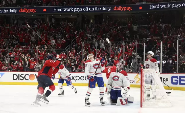 Montreal Canadiens goaltender Sam Montembeault (35) and others react after Washington Capitals left wing Alex Ovechkin (8) scored the winning goal in overtime of Game 1 of a first-round NHL hockey playoff series Monday, April 21, 2025, in Washington. (AP Photo/Nick Wass)