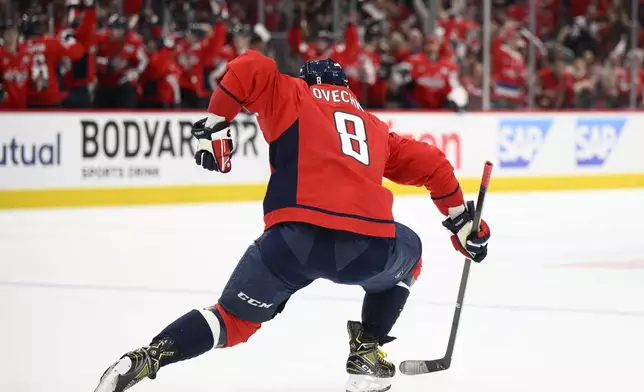 Washington Capitals left wing Alex Ovechkin (8) celebrates after his goal in the first period of Game 1 of a first-round NHL hockey playoff series against the Montreal Canadiens, Monday, April 21, 2025, in Washington. (AP Photo/Nick Wass)