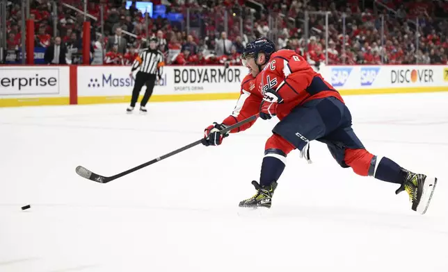 Washington Capitals left wing Alex Ovechkin (8) shoots for a goal in the first period of Game 1 of a first-round NHL hockey playoff series against the Montreal Canadiens, Monday, April 21, 2025, in Washington. (AP Photo/Nick Wass)
