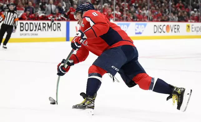 Washington Capitals left wing Alex Ovechkin (8) shoots for a goal in the first period of Game 1 of a first-round NHL hockey playoff series against the Montreal Canadiens, Monday, April 21, 2025, in Washington. (AP Photo/Nick Wass)