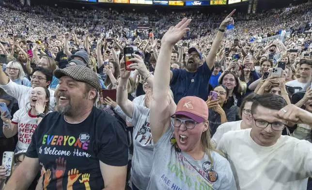Attendees cheer as Rep. Alexandra Ocasio-Cortez, D-N.Y., speaks during a "Fighting Oligarchy" event at the Ford Idaho Center in Nampa, Idaho, Monday, April 14, 2025. (AP Photo/Kyle Green)