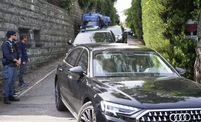 Iranian delegates leave the Omani Embassy in Rome after closed-door meeting with a U.S. delegation to discuss Tehran's rapidly advancing nuclear program, Saturday, April 19, 2025. (AP Photo/Andrew Medichini)