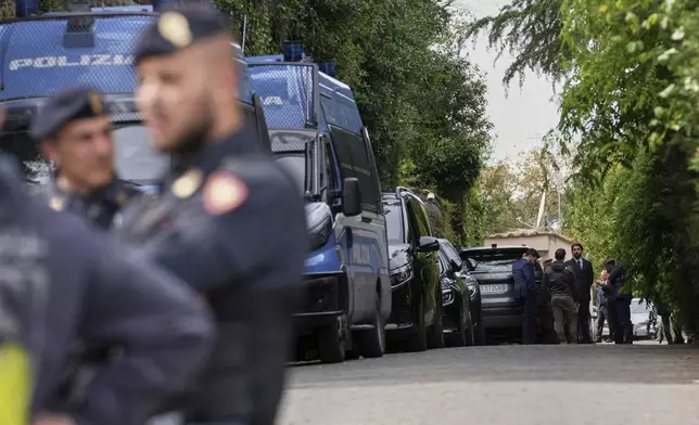 Police patrol outside the Omani Embassy in Rome during a closed-door meeting between U.S. and Iranian delegations to discuss Tehran's rapidly advancing nuclear program, Saturday, April 19, 2025. (AP Photo/Andrew Medichini)