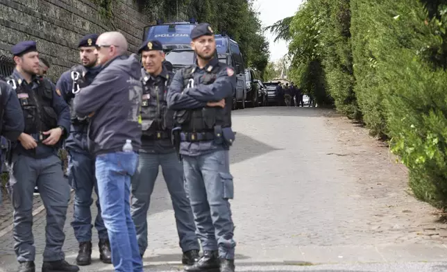 Police patrol outside the Omani Embassy in Rome during a closed-door meeting between U.S. and Iranian delegations to discuss Tehran's rapidly advancing nuclear program, Saturday, April 19, 2025. (AP Photo/Andrew Medichini)