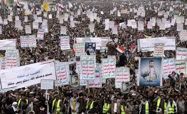 Thousands of Houthi supporters chant slogans during an anti-U.S. and anti-Israel rally in Sanaa, Yemen, Friday, April 18, 2025. (AP Photo/Osamah Abdulrahman)
