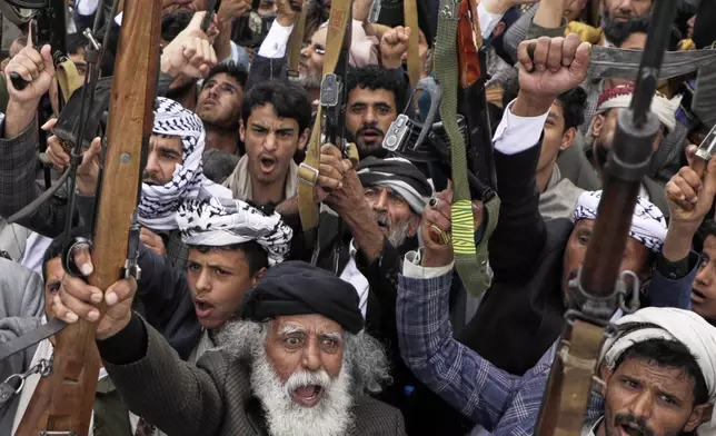 Houthi supporters chant slogans during an anti-U.S. and anti-Israel rally in Sanaa, Yemen, Friday, April 18, 2025. (AP Photo/Osamah Abdulrahman)