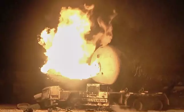 In this photo taken from video released by Al Masirah TV channel shows a burning oil tanker after U.S. airstrikes targeted the Ras Isa oil port held by Yemen's Houthi rebels in Hodeida, Yemen, Friday, April 18, 2025.( Al Masirah TV via AP)