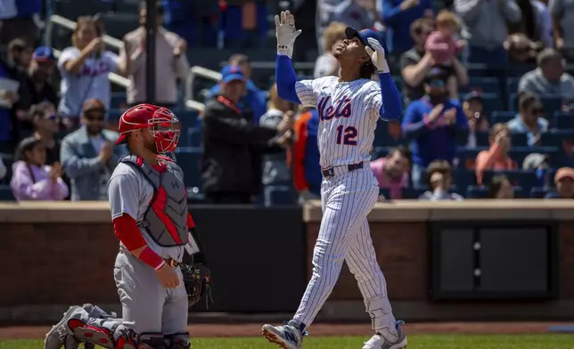 New York Mets' Francisco Lindor (12) reacts after hitting a home run, during the first inning of a baseball game against the St. Louis Cardinals, Sunday, April 20, 2025, in New York. (AP Photo/Angelina Katsanis)