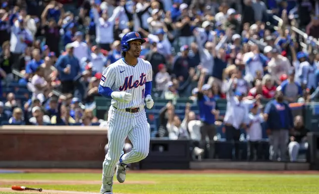 New York Mets' Francisco Lindor (12) makes the first home run of the game, and his third of the season, during the first inning against the St. Louis Cardinals, Sunday, April 20, 2025, in New York. (AP Photo/Angelina Katsanis)