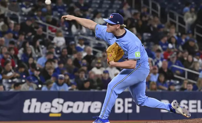 Toronto Blue Jays relief pitcher Paxton Schultz throws to a Seattle Mariners batter in the third inning of a baseball game in Toronto on Sunday, April 20, 2025. (Jon Blacker/The Canadian Press via AP)