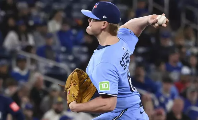 Toronto Blue Jays relief pitcher Paxton Schultz throws to a Seattle Mariners batter in the third inning of a baseball game in Toronto on Sunday, April 20, 2025. (Jon Blacker/The Canadian Press via AP)