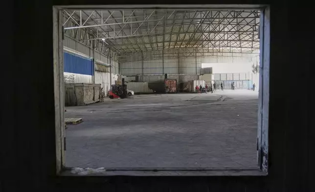 A World Food Program warehouse is seen empty in the Nuseirat refugee camp, Gaza Strip, Saturday April 26, 2025. (AP Photo/Abdel Kareem Hana)