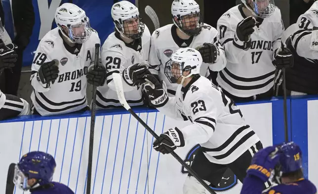 FILE - Western Michigan left wing Liam Valente (23) celebrates with his bench after scoring against Minnesota State in the second period during the first round of the NCAA college hockey tournament on Thursday, March 27, 2025, in Fargo, N.D. (AP Photo/Craig Lassig, File)