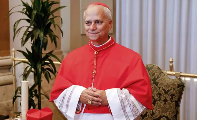 FILE - New Cardinal Robert Francis Prevost, Prefect of the Dicastery for Bishops, poses for a photo at the end of the consistory where Pope Francis elevated 21 new cardinals in St. Peter's Square at the Vatican, Saturday, Sept. 30, 2023. (AP Photo/Riccardo De Luca, file)