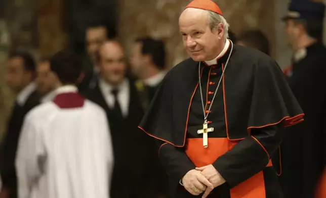 FILE - Cardinal Christoph Schoenborn, of Austria, attends a vespers celebration in St. Peter's Basilica at the Vatican, Wednesday, March 6, 2013. (AP Photo/Gregorio Borgia, File)