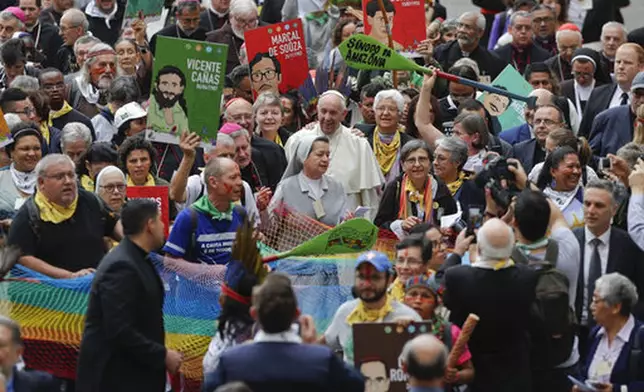 FILE - Pope Francis walks in procession on the occasion of the Amazon synod, a three-week meeting on preserving the rainforest and ministering to its native people, at the Vatican, Monday, Oct. 7, 2019. (AP Photo/Andrew Medichini, file)