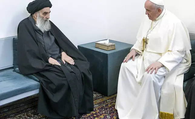 FILE - In this March 6, 2021 file photo, Pope Francis, right, meets with Iraq's leading Shiite cleric, Grand Ayatollah Ali al-Sistani in Najaf, Iraq. Pope Franics became the first pope to visit both the Arabian Peninsula and Iraq, the birthplace of Abraham, a prophet important to Christians, Muslims and Jews. (AP Photo/Vatican Media, file)