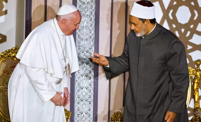 FILE - Sheikh Ahmed el-Tayeb, right, Grand Imam of Al-Azhar, the pre-eminent institute of Islamic learning in the Sunni Muslim world, right, welcomes Pope Francis at the international peace conference in Cairo, Egypt, Friday, April 28, 2017. (AP Photo/Amr Nabil, file)