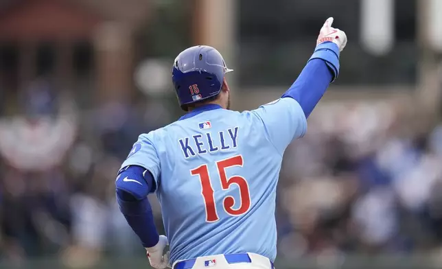 Chicago Cubs' Carson Kelly (15) runs the bases after hitting a three-run home run during the sixth inning of a baseball game against the San Diego Padres, Saturday, April 5, 2025, in Chicago. (AP Photo/Erin Hooley)
