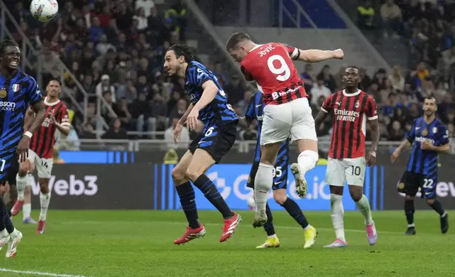 AC Milan's Luka Jovic scores during the Italian Cup semifinal second leg soccer match between Inter Milan and AC Milan at the San Siro stadium in Milan, Italy, Wednesday, April 23, 2025. (AP Photo/Luca Bruno)