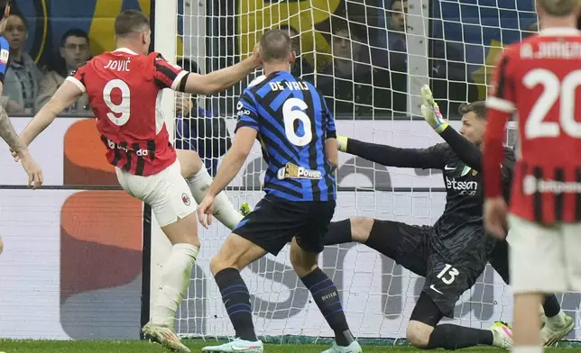 AC Milan's Luka Jovic scores during the Italian Cup semifinal second leg soccer match between Inter Milan and AC Milan at the San Siro stadium in Milan, Italy, Wednesday, April 23, 2025. (AP Photo/Luca Bruno)
