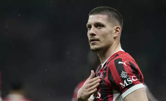 AC Milan's Luka Jovic reatcs after scoring during the Italian Cup semifinal second leg soccer match between Inter Milan and AC Milan at the San Siro stadium in Milan, Italy, Wednesday, April 23, 2025. (AP Photo/Luca Bruno)