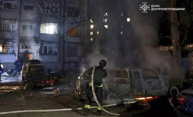 In this photo, provided by the Ukrainian Emergency Service, firefighters extinguish fire following a Russian attack in Dnipro, Thursday, April 17, 2025. (Ukrainian Emergency Service via AP)