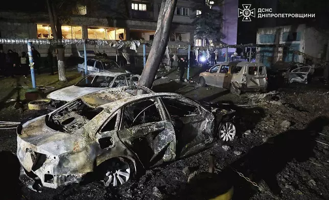 In this photo, provided by the Ukrainian Emergency Service, firefighters extinguish fire following a Russian attack in Dnipro, Thursday, April 17, 2025. (Ukrainian Emergency Service via AP)