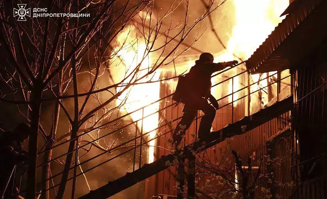 In this photo, provided by the Ukrainian Emergency Service, firefighters extinguish fire following a Russian attack in Dnipro, Thursday, April 17, 2025. (Ukrainian Emergency Service via AP)