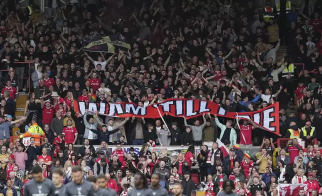Wrexham fans support their team prior to the English League One soccer match between Wrexham and Charlton Athletic at the Racecourse ground in Wrexham, Wales, Saturday, April 26, 2025. (AP Photo/Jon Super)