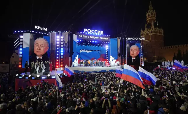 FILE - Russian President Vladimir Putin is seen on a screen as he attends a concert in Red Square in Moscow, on March 18, 2024, marking the 10th anniversary of Russia’s annexation of Crimea. (AP Photo/Alexander Zemlianichenko, File)