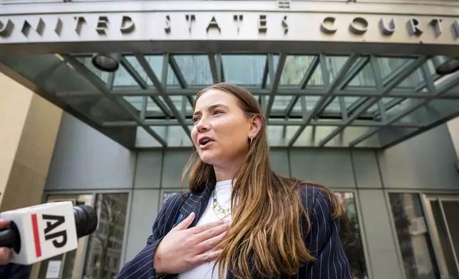 College soccer player Lexi Drumm leaves federal court during a hearing for a landmark $2.8 billion settlement impacting NCAA college athletics on Monday, April 7, 2025, in Oakland, Calif. (AP Photo/Noah Berger)