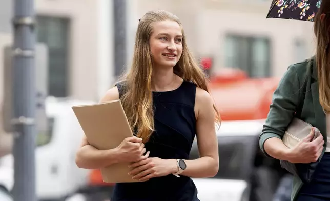 High school runner Gracelyn Laudermilch, who objects to a landmark settlement with the NCAA, arrives at federal court on Monday, April 7, 2025, in Oakland, Calif. (AP Photo/Noah Berger)