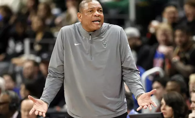 Milwaukee Bucks head coach Doc Rivers reacts while talking to an official during the first half of an NBA basketball game against the Detroit Pistons, Friday, April 11, 2025, in Detroit. (AP Photo/Duane Burleson)