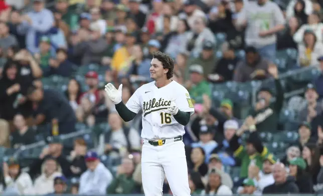 Athletics Nick Kurtz (16) celebrates his first career major league hit against the Texas Rangers during the first inning of a baseball game, Wednesday, April 23, 2025, in West Sacramento, Calif. (AP Photo/Scott Marshall)