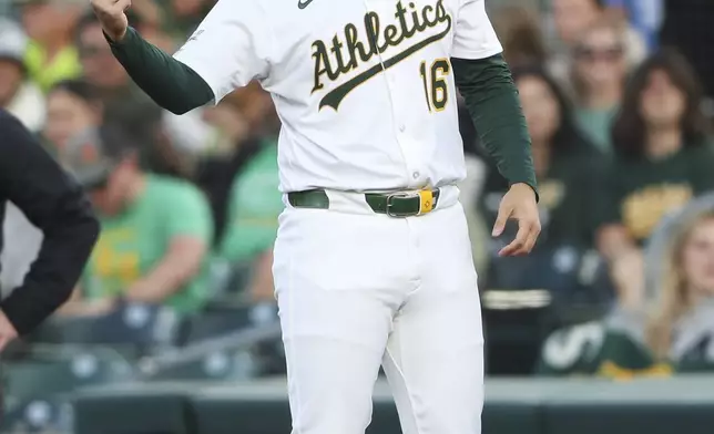 Athletics Nick Kurtz (16) celebrates his first career major league hit against the Texas Rangers during the first inning of a baseball game, Wednesday, April 23, 2025, in West Sacramento, Calif. (AP Photo/Scott Marshall)