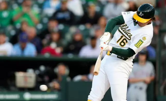 Athletics Nick Kurtz (16) get his first career major league hit against the Texas Rangers during the first inning of a baseball game, Wednesday, April 23, 2025, in West Sacramento, Calif. (AP Photo/Scott Marshall)