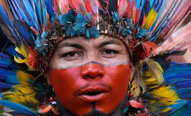 An Indigenous man attends a march coined: "We are the answer" in Brasilia, Brazil, Thursday, April 10, 2025, during the annual Free Earth camp where Brazil's Indigenous people discuss rights, territorial protection and their role in COP30 which will take place for the first time in the Amazon. (AP Photo/Eraldo Peres)