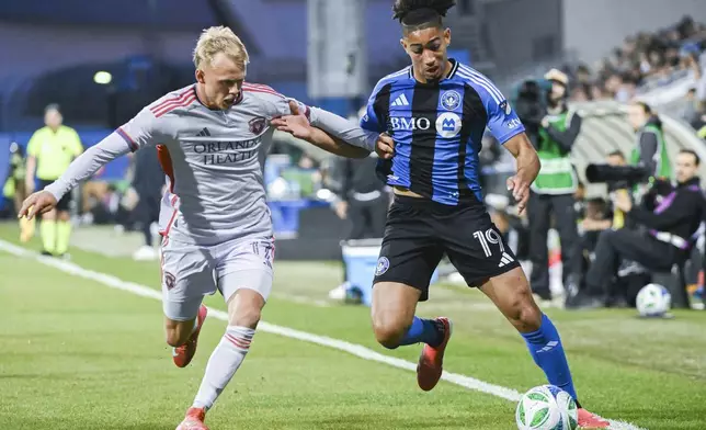 Orlando City's Dagur Dan Thorhallsson, left, challenges CF Montreal's Nathan-Dylan Saliba (19) during first half MLS soccer action in Montreal, Saturday, April 19, 2025. (Graham Hughes/The Canadian Press via AP)