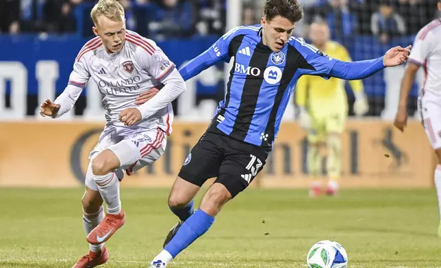 Orlando City's Dagur Dan Thorhallsson (17) challenges CF Montreal's Luca Petrasso (13) during first half MLS soccer action in Montreal, Saturday, April 19, 2025. (Graham Hughes/The Canadian Press via AP)