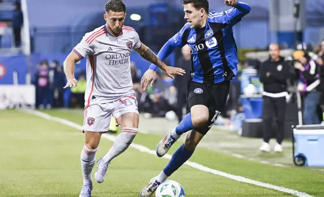 Orlando City's Marco Pašalić (87) challenges CF Montreal's Luca Petrasso (13) during first half MLS soccer action in Montreal, Saturday, April 19, 2025. (Graham Hughes/The Canadian Press via AP)